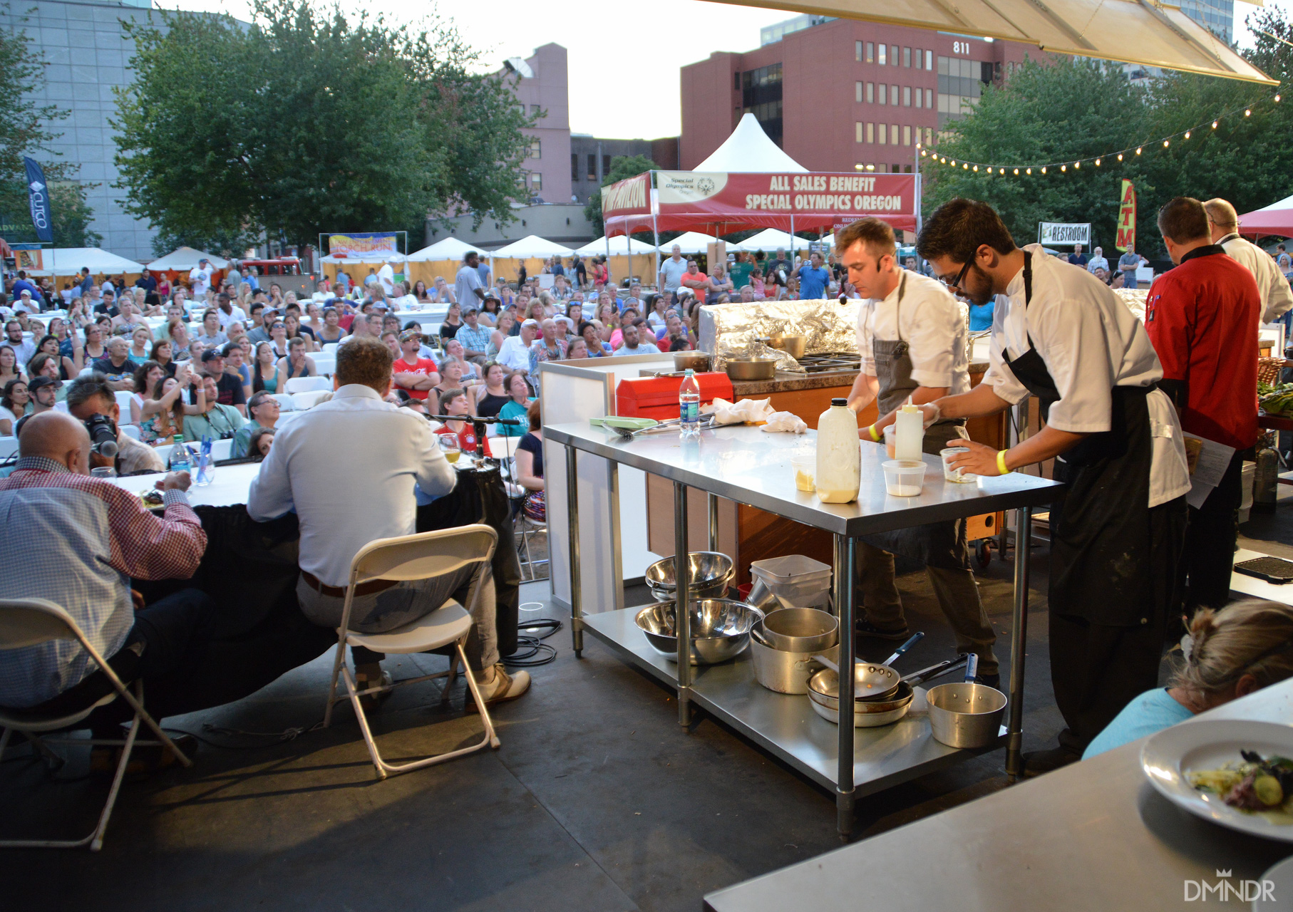 Oregon Iron Chef Competition winners at work looking out at the crowd