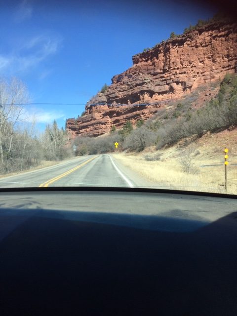 red mountain pass caution sign colorado windsheild
